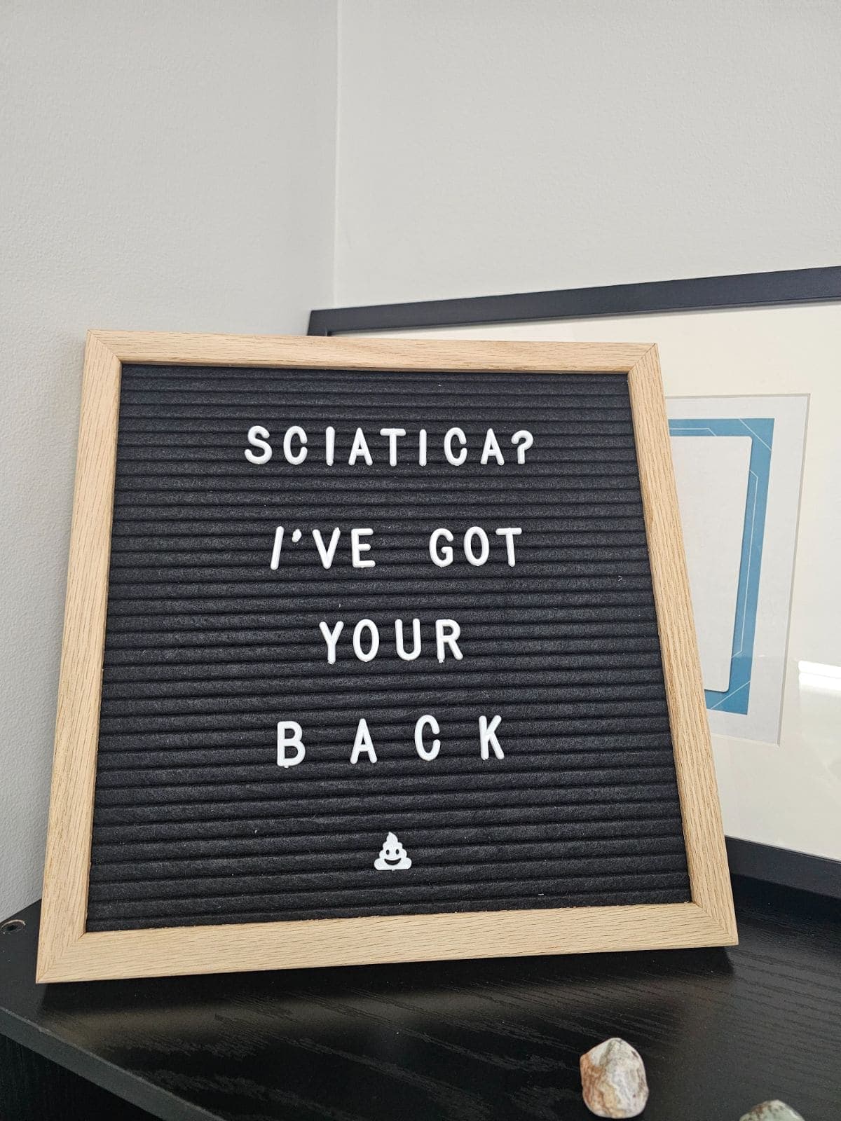 A letterboard on the clinic wall reading Sciatica? I've got your back