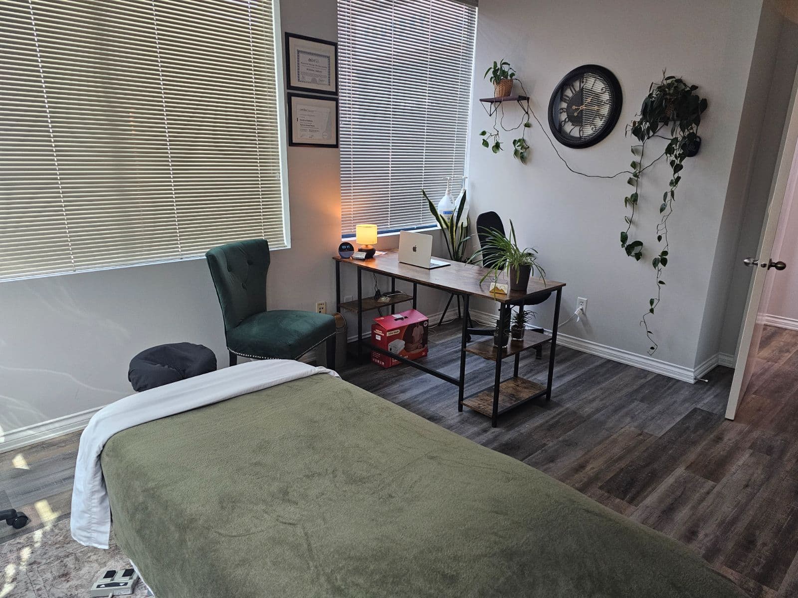 A treatment room at Back in Health prepared for a hot stone massage session
